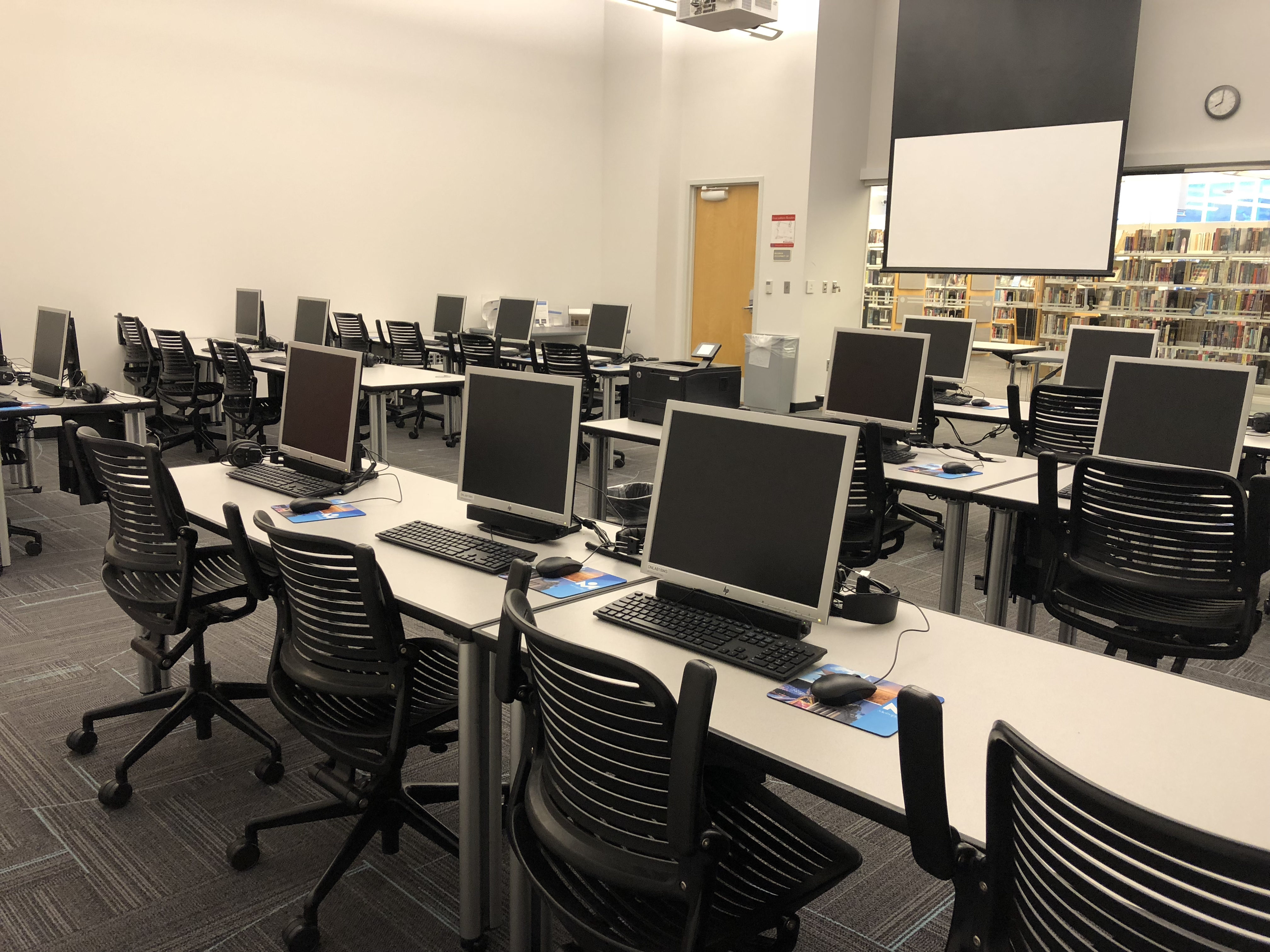 Route 66 Computer Lab with rows of computers and large screen
