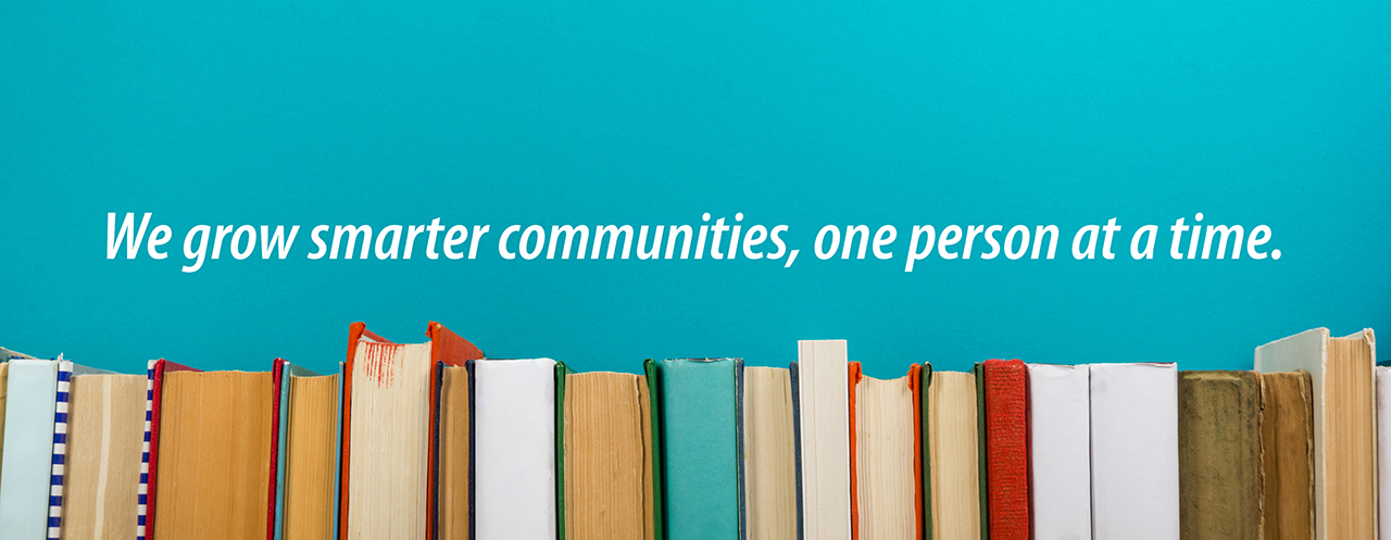 Mission and History header image Graphic with stack of books captioned "We grow smarter communities, one person at a time."