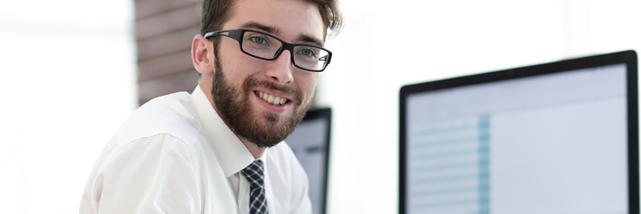 Smiling guy on computer