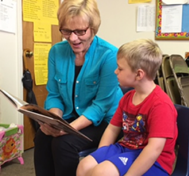 Martin reading to a child