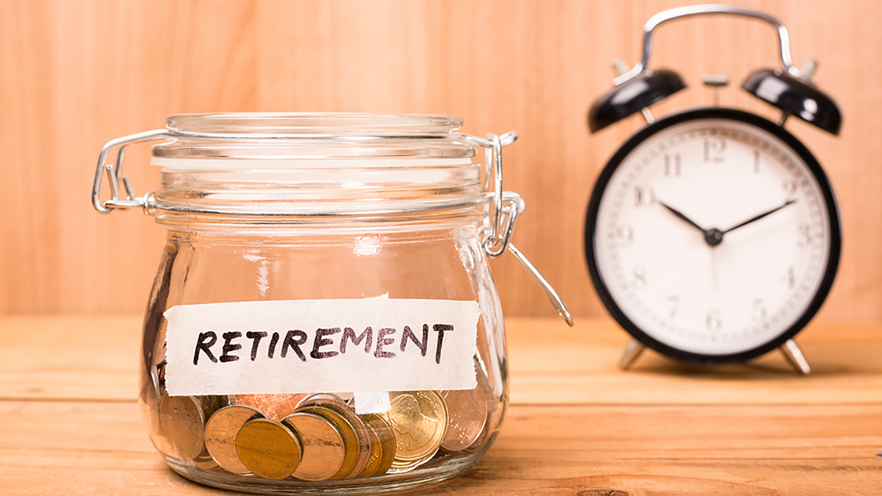 Jar filled with coins with a label that reads, "Retirement"