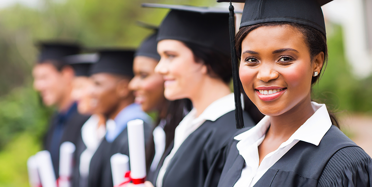 A group of recent high school graduates with caps and gowns