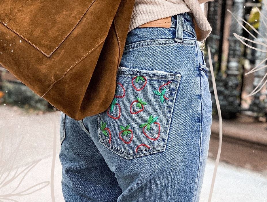 jeans with strawberries embroidered on the back pocket