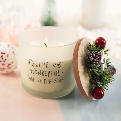 white holiday candle that says "the most wonderful time of the year"