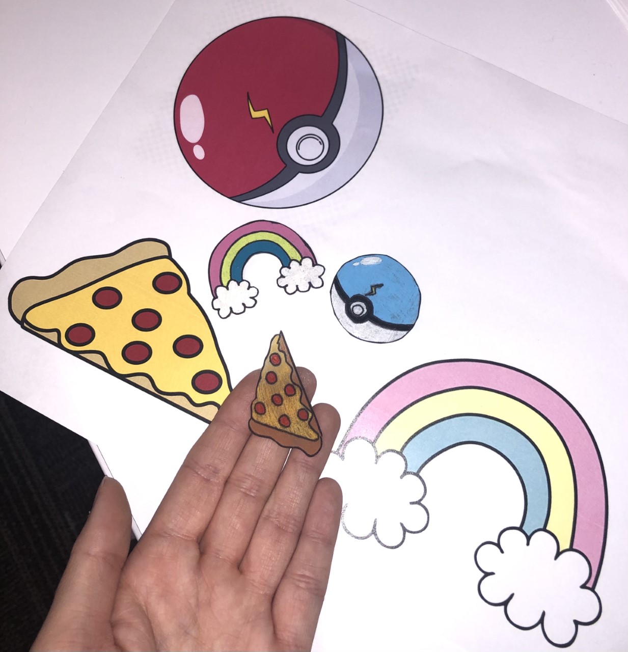 Photo of sample shrink art creations: rainbow, pizza, pokeball