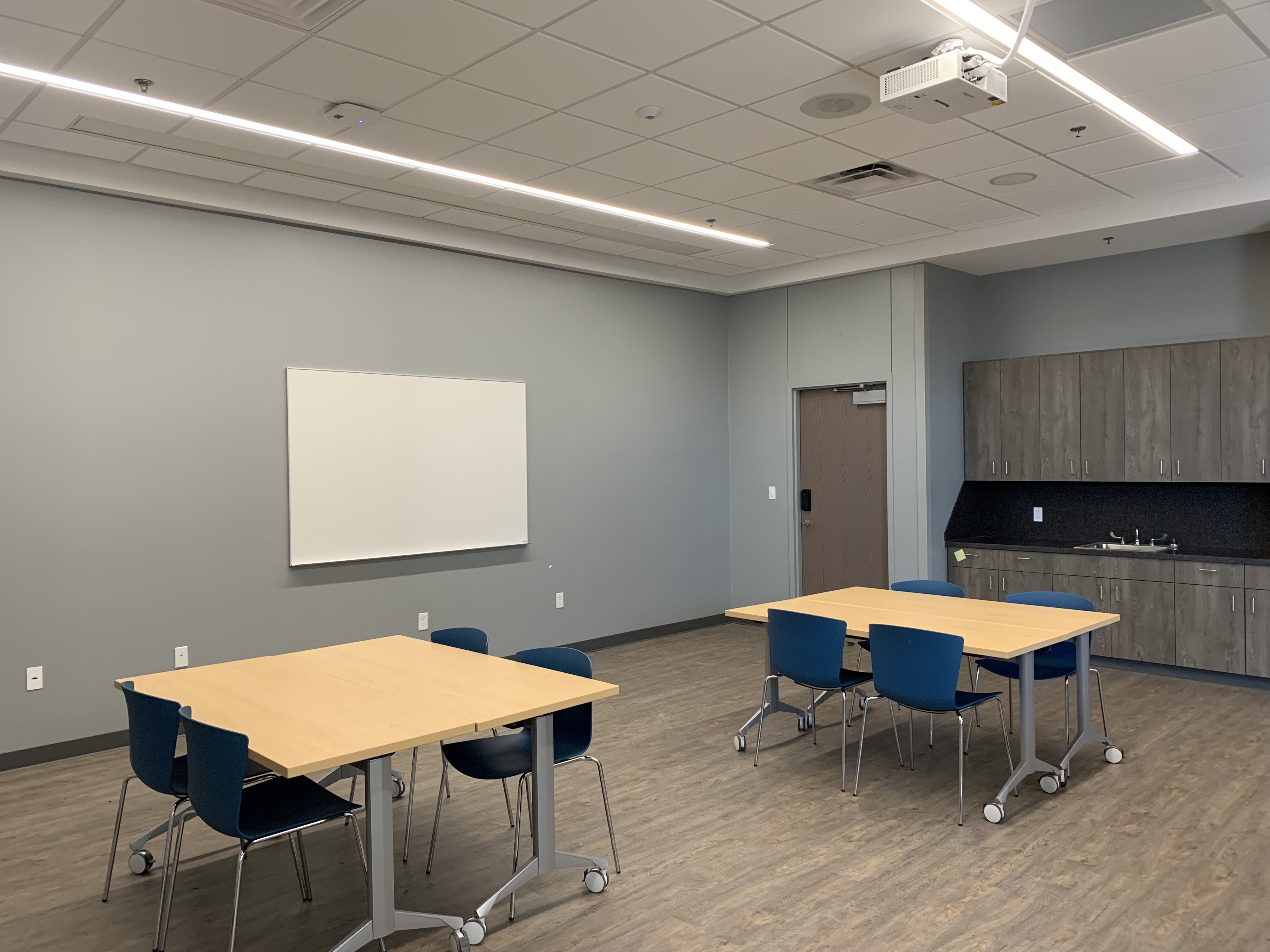 Meeting Room A at the Del City Library with rectangular tables and chairs