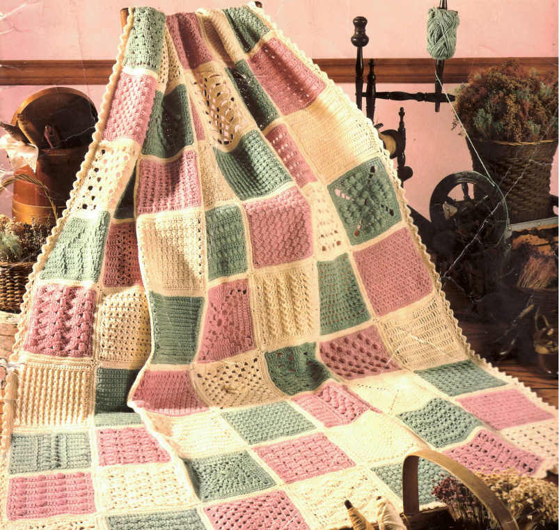 Image of crocheted blanket with many different stitches in 3 alternating colors
