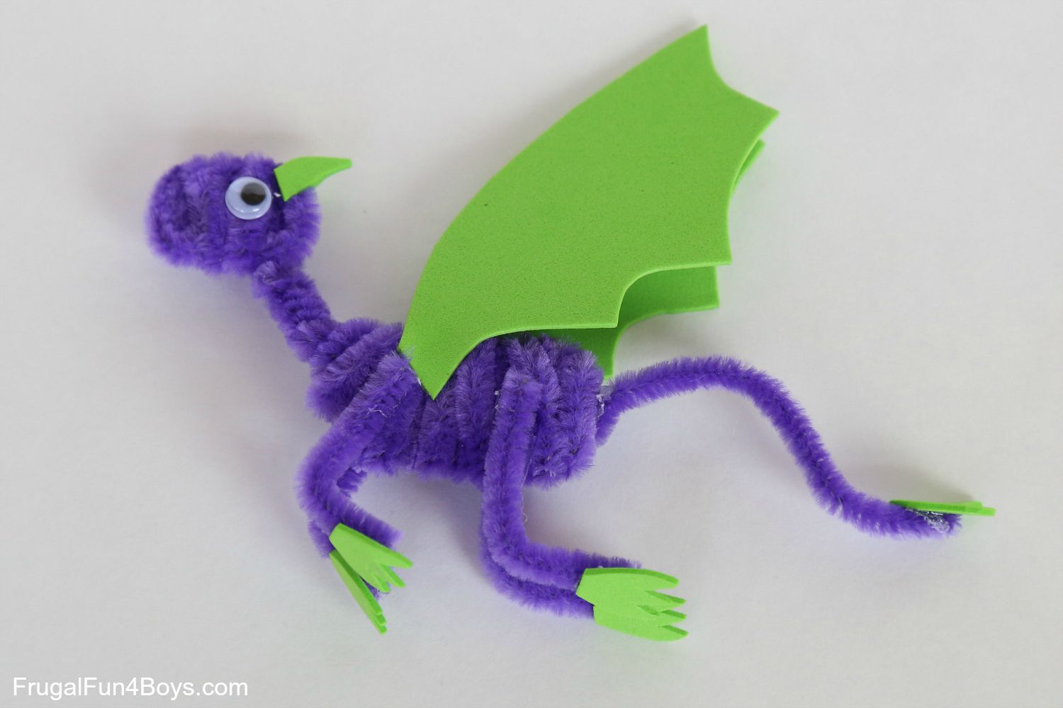 purple and green dragon made of pipe cleaner