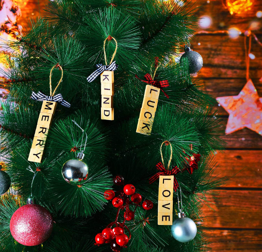 Ornaments made from Scrabble tiles on an evergreen tree