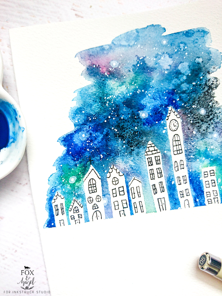 Black and white buildings with watercolor galaxy background in blues