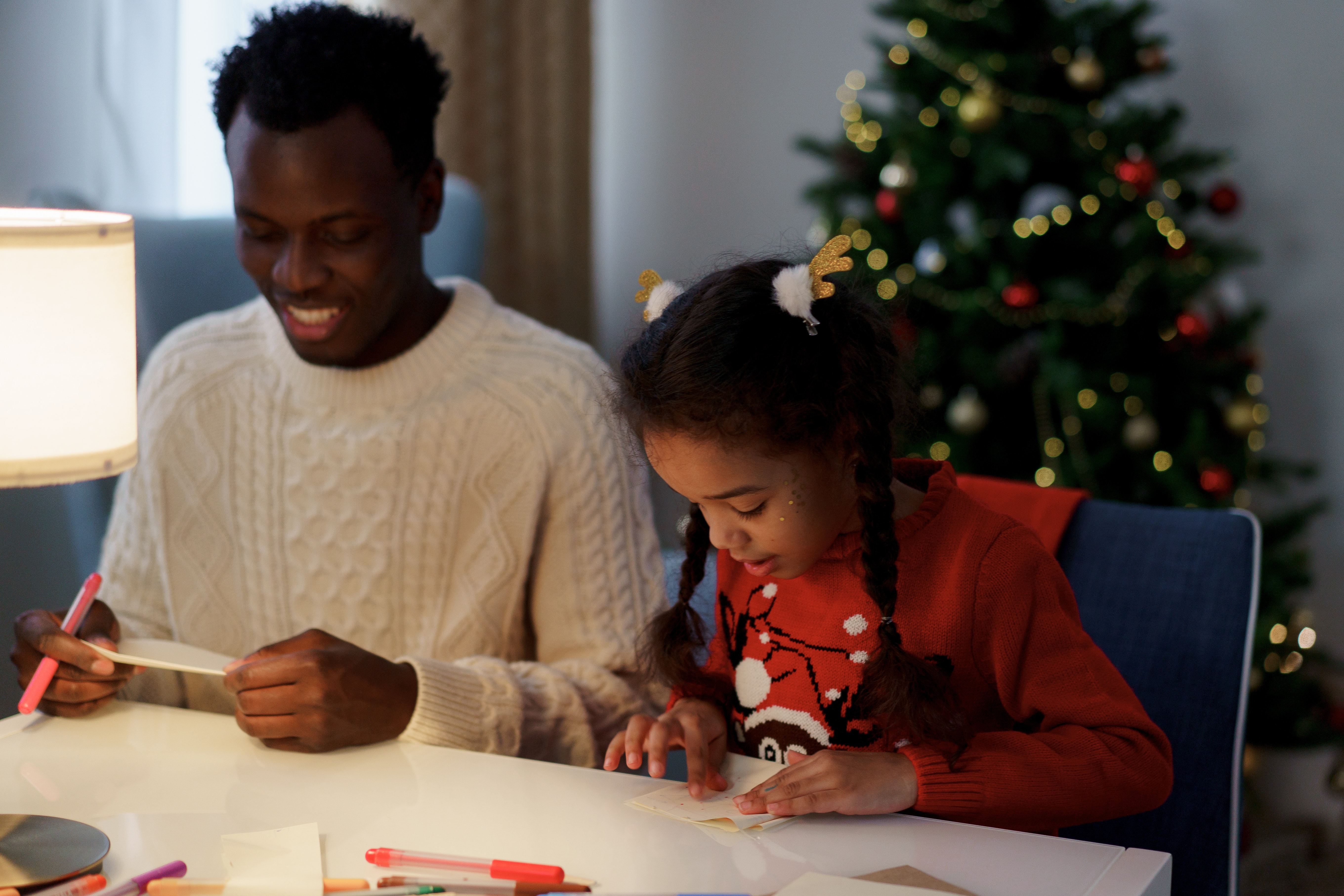 Father and daughter making a card. Photo by cottonbro studio: https://www.pexels.com/photo/dad-and-daughter-making-a-christmas-letter-6140240/
