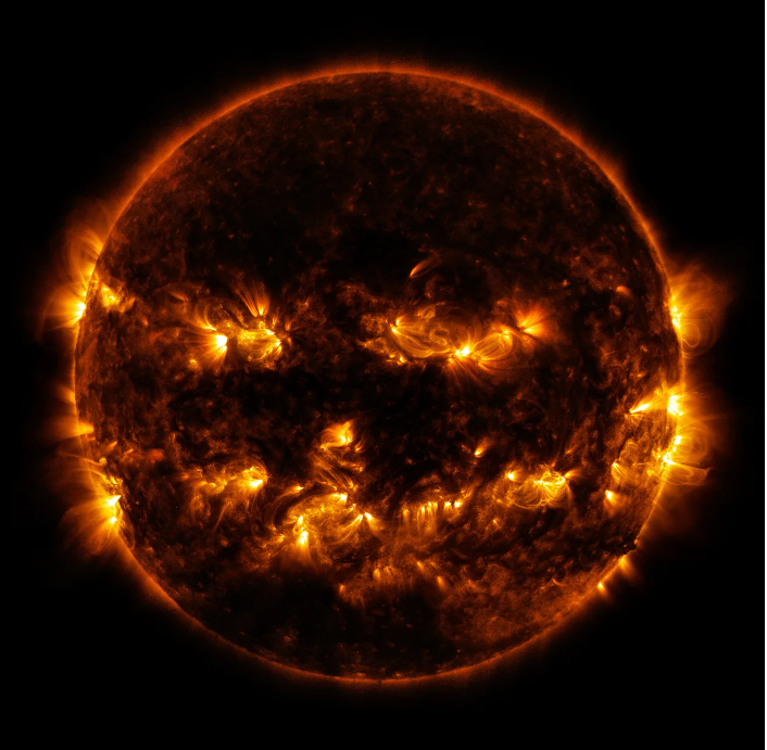 sun in space with flares resembling a jack o lantern
