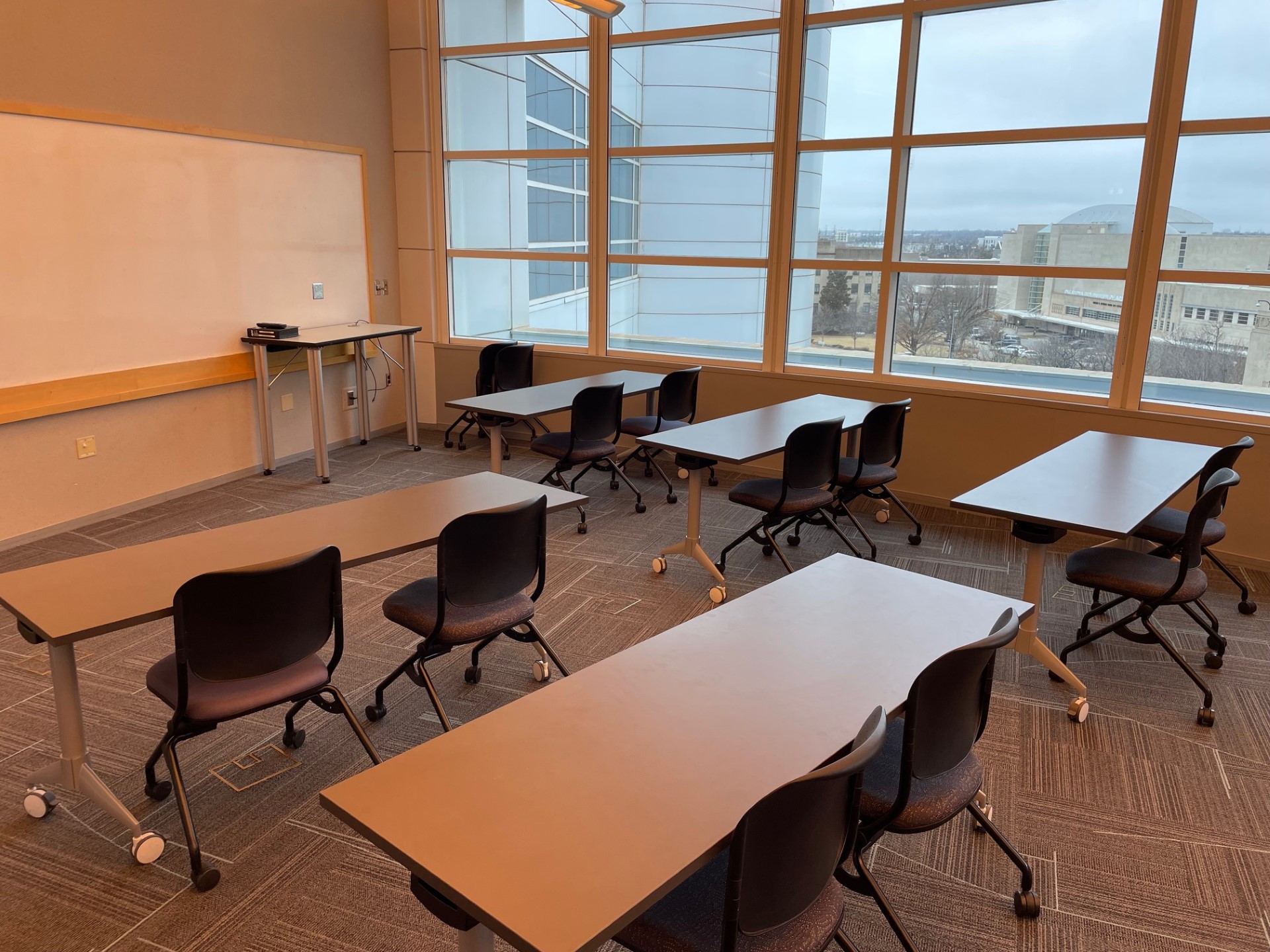 Classroom E with classroom-style seating and whiteboard
