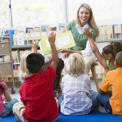 Teacher reading to children