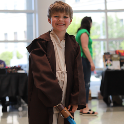 Young boy dressed as a jedi