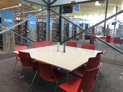 Explore Room at the Northwest Library with square table and ten chairs