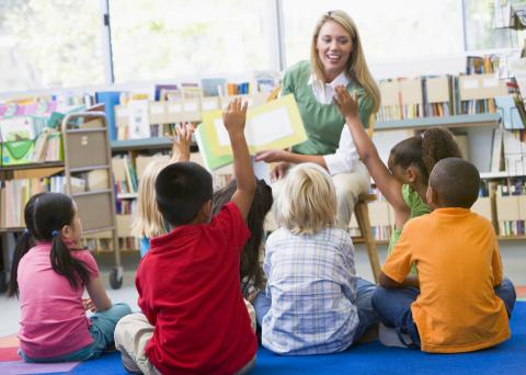 Teacher reading to children