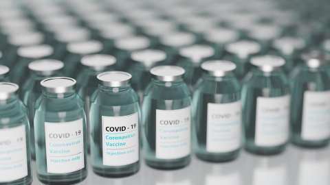 vials of covid 19 vaccine lined up