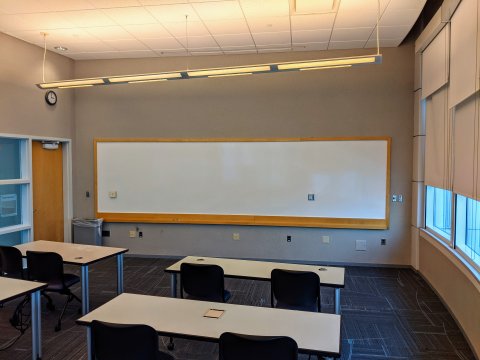 Classroom C with classroom-style seating and whiteboard