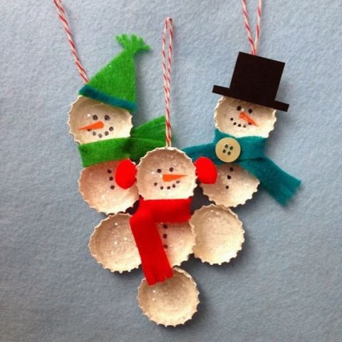 snowmen made of bottle caps with felt accessories