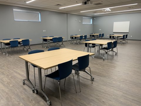 Meeting Room AB at the Del City Library with rectangular tables and chairs