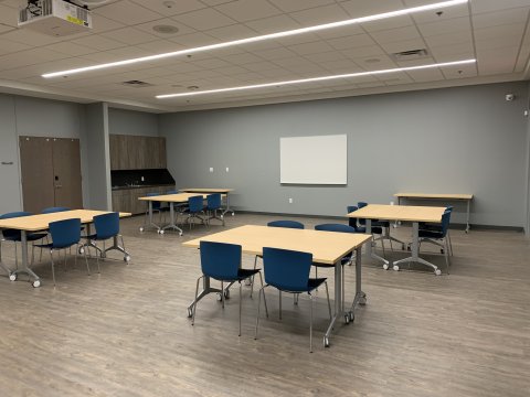Meeting Room B at the Del City Library with rectangular tables and chairs