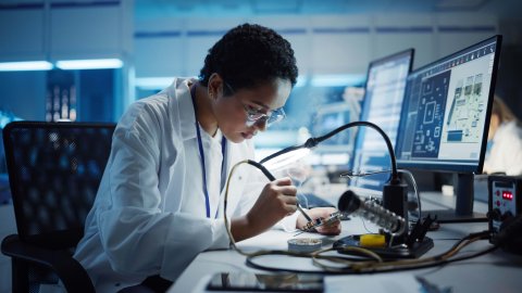 Woman concentrated on her work as an engineer.