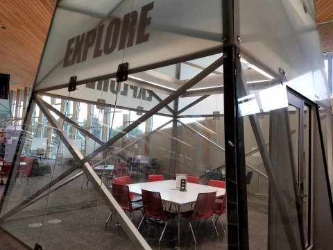 Explore Room at the Northwest Library with square table and 8 chairs