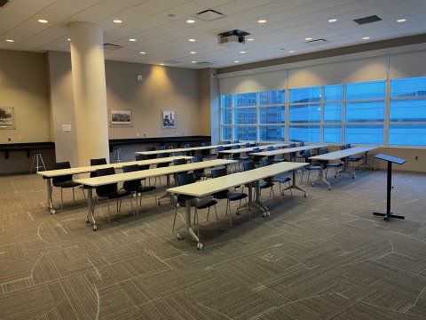 Friends Room with two chairs at each rectangle table