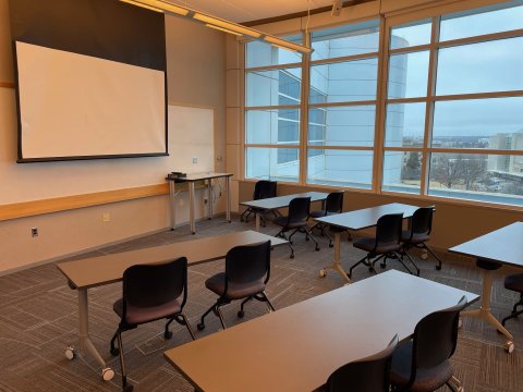 Classroom D with classroom-style seating and large screen at front of room