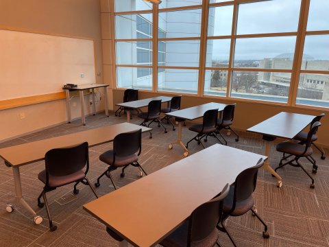 Classroom B with classroom-style seating, podium, and whiteboard