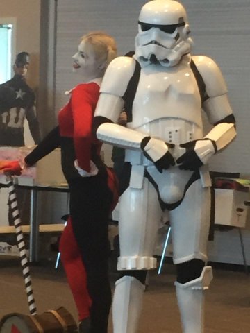 Harley Quinn and Storm Trooper cosplayers.