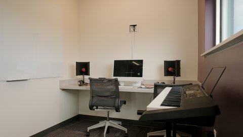 The podcast room at Almonte Library showing a Mac computer, speakers, keyboard piano, and other equipment