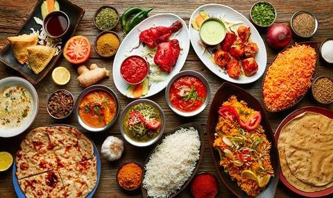 Various food dishes of the world on a table