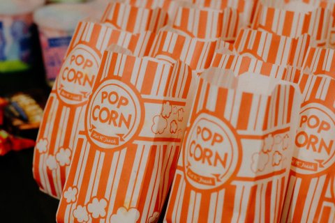 Bags of popcorn - Photo by Nino  Sanger: https://www.pexels.com/photo/paper-popcorn-bags-in-row-19591130/