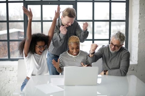 Photo by Andrea Piacquadio: https://www.pexels.com/photo/excited-multiracial-colleagues-enjoying-triumph-together-in-front-of-laptop-in-office-3931634/