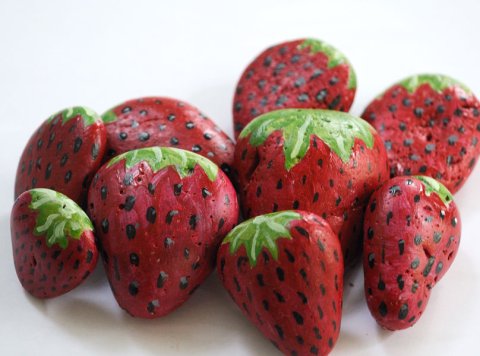 Rocks painted to look like strawberries