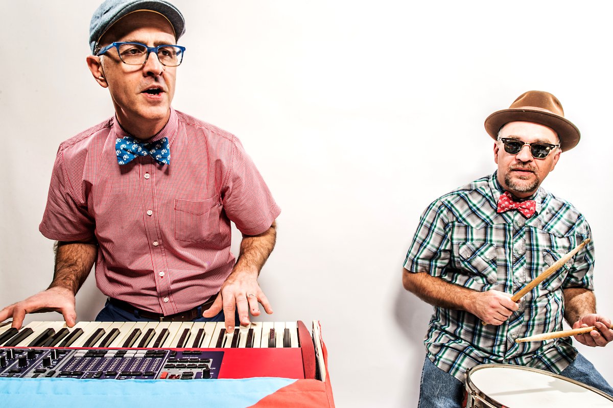Boom playing the keyboard and Dr. Rock playing the drums