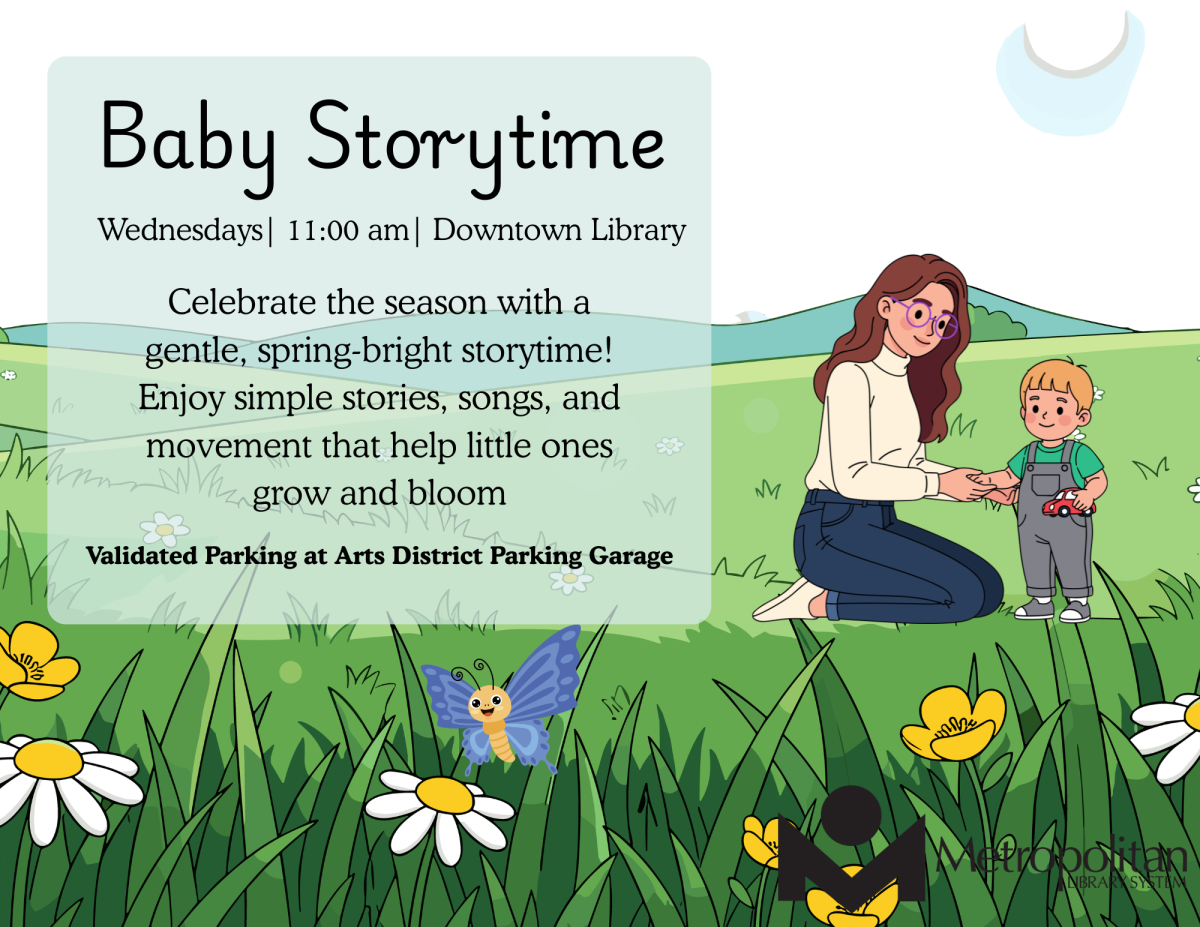 Image shows a mother and her child in the middle of a meadow with flowers blooming. 