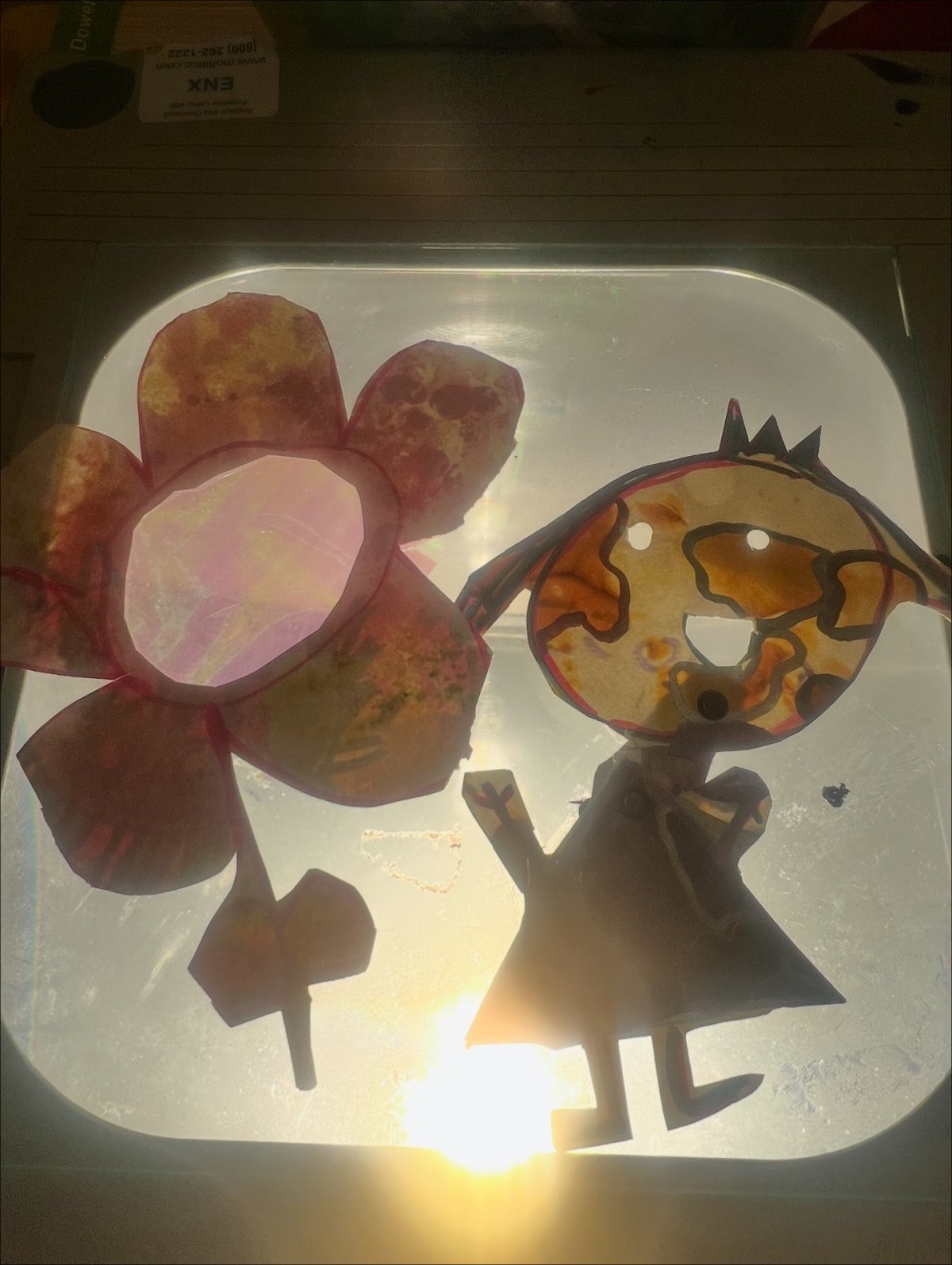 Handmade puppets on a light projector